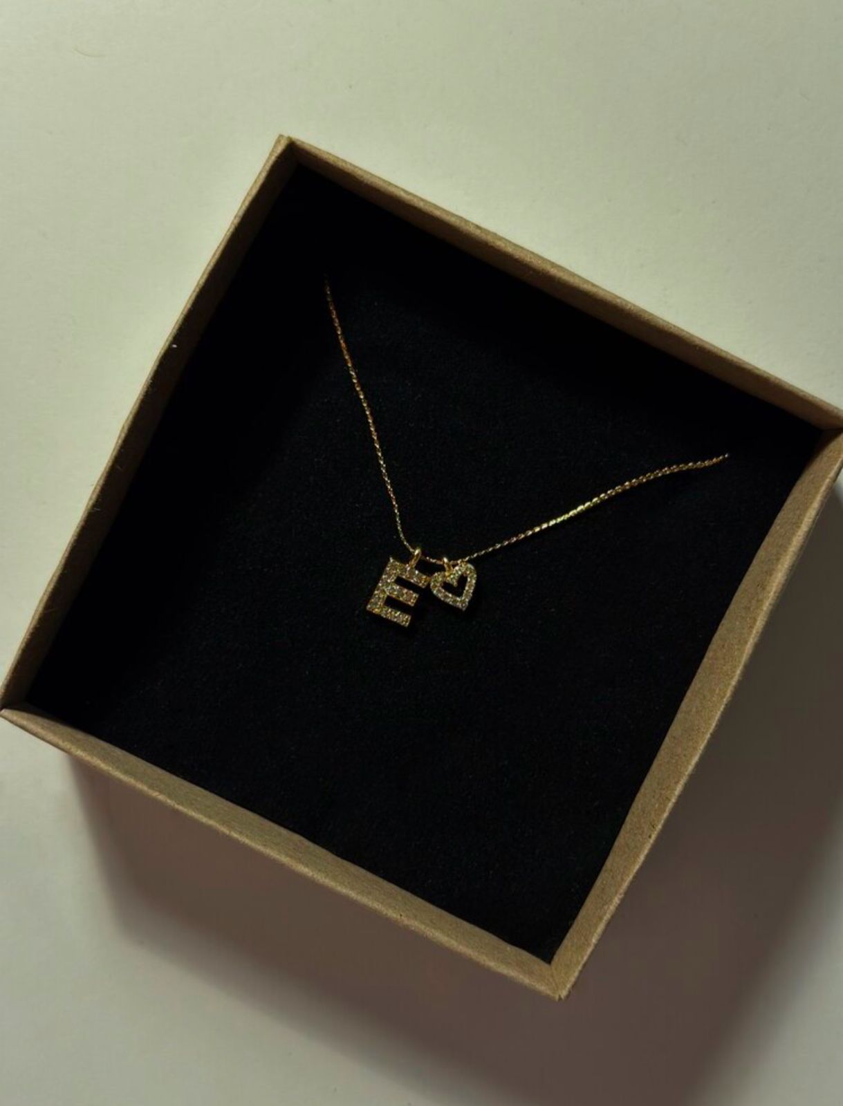 Letter with heart necklace